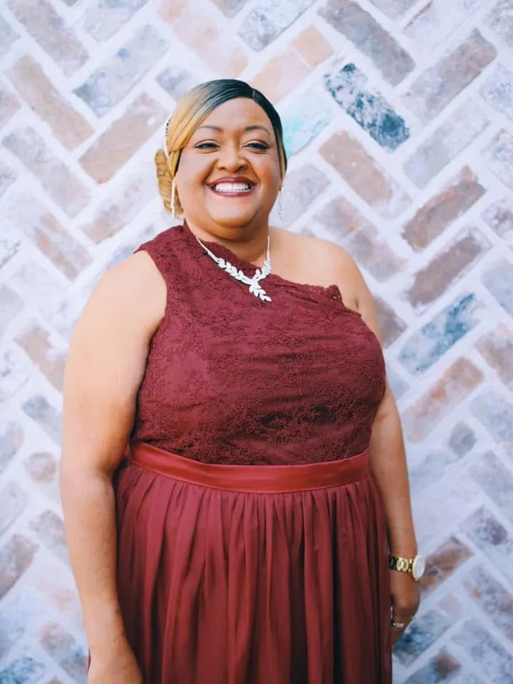 Mother of the bride in a burgundy lace and chiffon gown